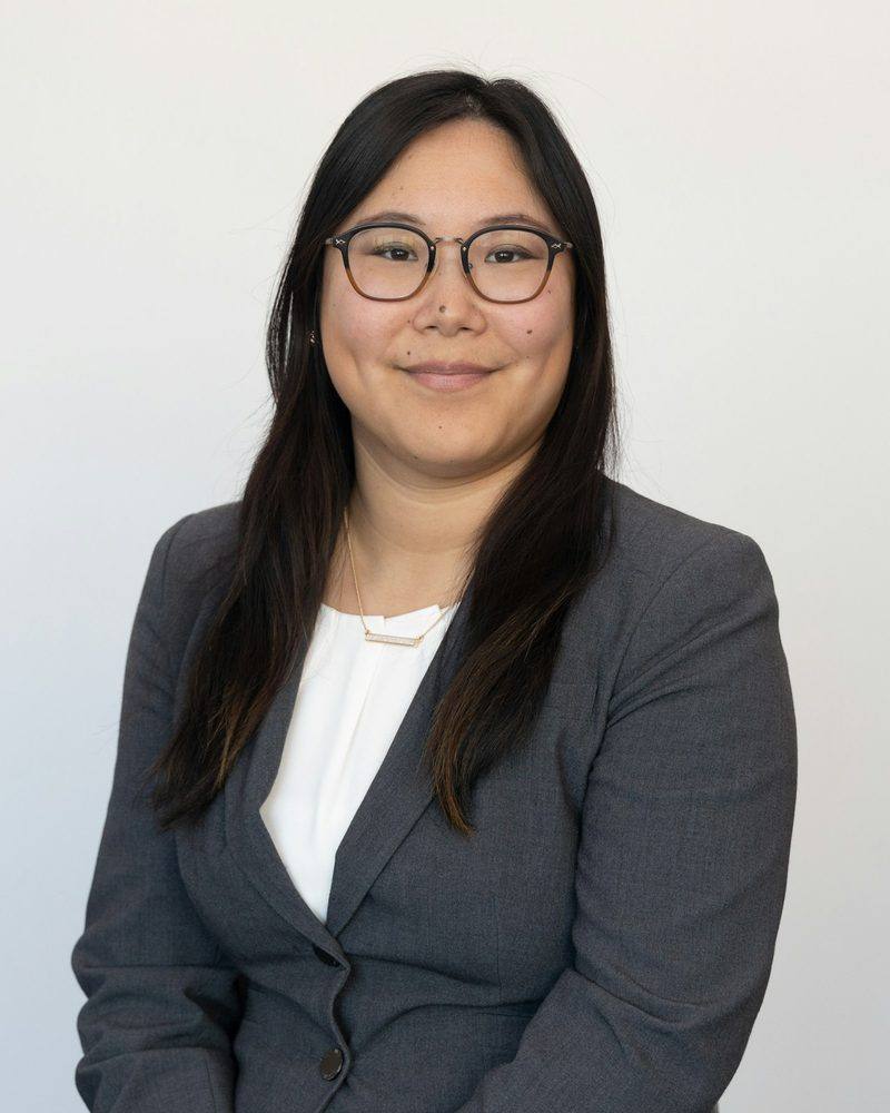 Mara Chen, founder of Northstar Security Advisors, in a grey blazer and glasses